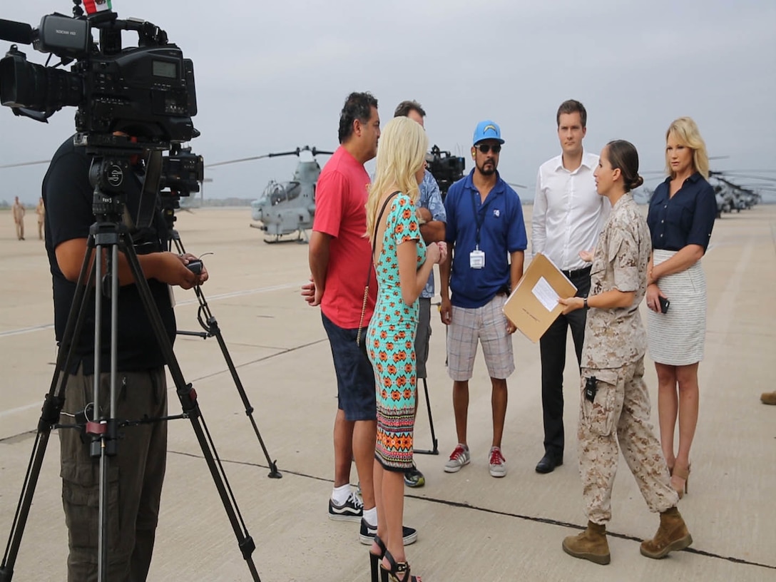 Capt. Melanie Salinas, public affairs officer with 3rd Marine Aircraft Wing, briefs the media before the Marine Corps Air Station Miramar Media Day aboard MCAS Miramar, California, July 29 The MCAS Miramar Media Day allowed the media an opportunity to delve deeper into the moving parts that make the air station and the Marine Corps work. (U.S. Marine Corps photo by Cpl. Alissa P. Schuning)