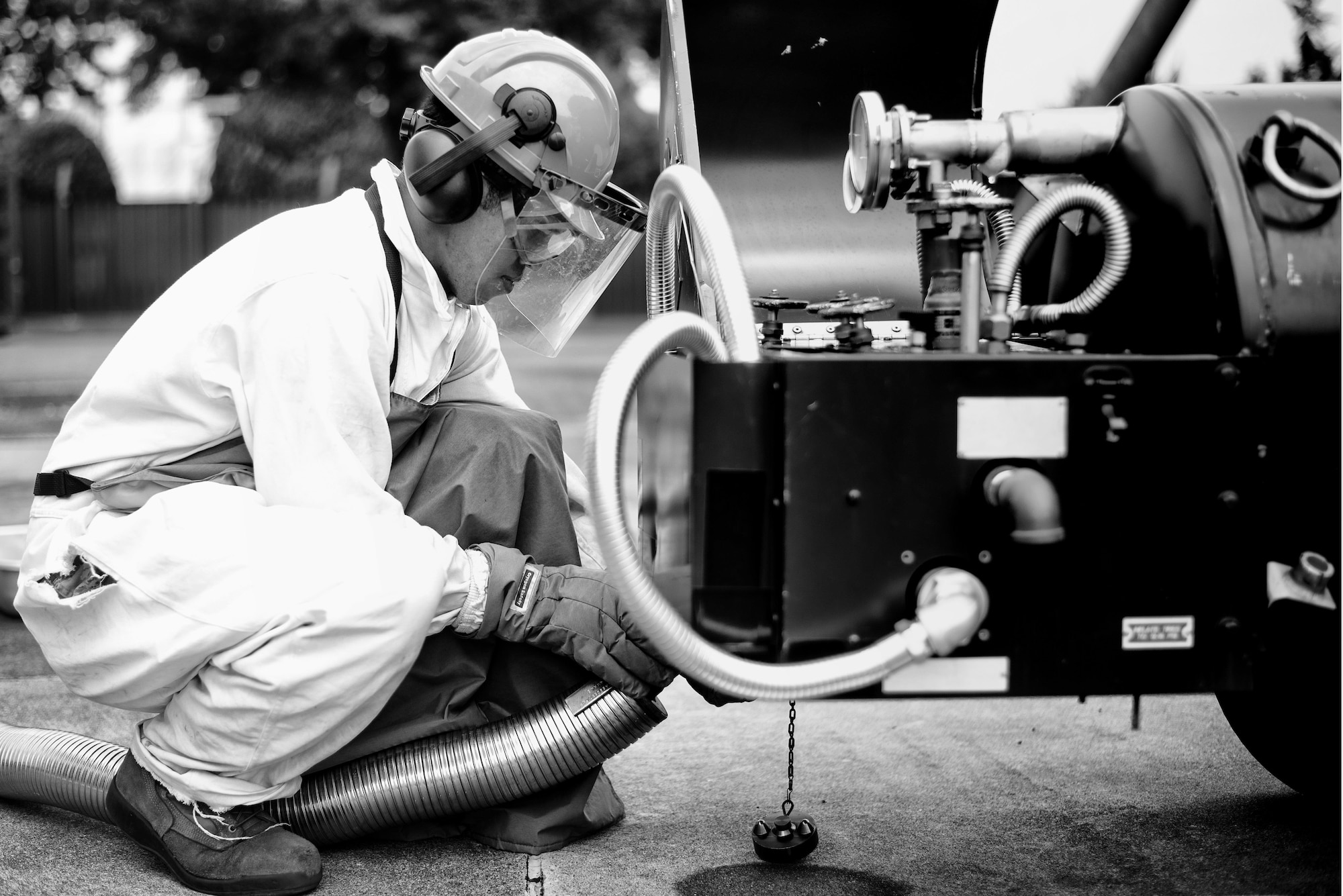 U.S. Air Force Senior Airman Christopher Benavente, 374th Logistics Readiness Squadron cryogenic technician, attaches a hose carrying liquid oxygen to a LOX tank July 29, 2015, at Yokota Air Base, Japan. The LRS cryogenics lab supplies the 374th Aircraft Maintenance Squadron and the 730th Air Mobility Squadron with their LOX and liquid nitrogen needs. (U.S. Air Force photo by Airman 1st Class Delano Scott/Released)
