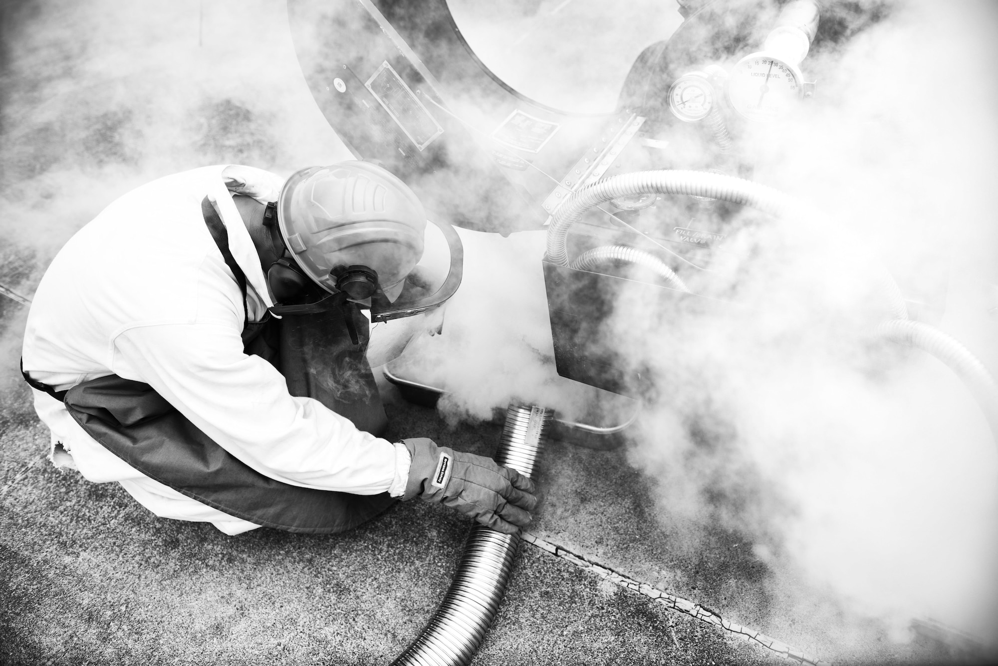 U.S. Air Force Senior Airman Christopher Benavente, 374th Logistics Readiness Squadron cryogenic technician, detaches a hose carrying liquid oxygen to a LOX tank July 29, 2015, at Yokota Air Base, Japan. The cryogenics shop provides liquid oxygen to both the 374th Aircraft Maintenance Squadron and the 730th Air Mobility Squadron that is used as breathing oxygen for pilots when flying over 10,000 feet. (U.S. Air Force photo by Airman 1st Class Delano Scott/Released)
