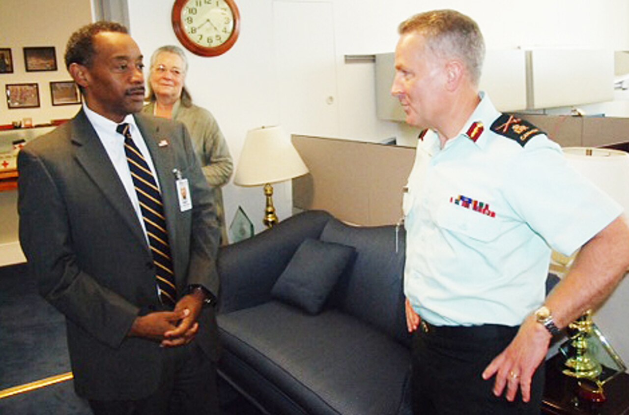 Dr. Jonathan Woodson, assistant secretary of defense for health affairs, left, meets with Canadian Forces Health Services commander and Surgeon General Army Brig. Gen. Hugh C. MacKay at the Pentagon, July 30, 2015. DoD photo by John Davis