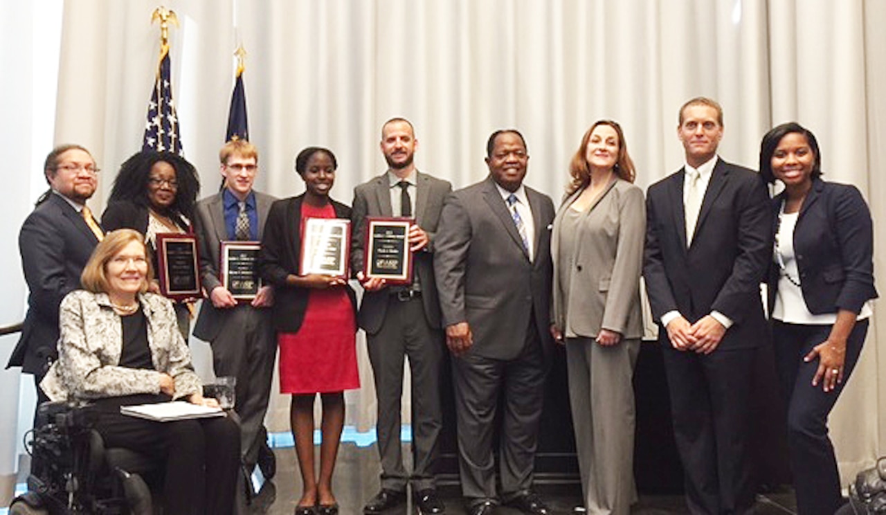 Awardees and officials at the Judith C. Gilliom Award ceremony at the National Youth Transitions Center, pose for a photograph, July 31, 2015. From left, Jennifer Sheehy, Acting Assistant Secretary of Labor for Disability Employment Policy; Mr. Patrick Cokley, Workforce Recruitment Program Director in the Department of Labor’s Office of Disability Employment Policy; Judith Gilliom Workforce Recruitment Program award recipients Divya Hazel, Bryan Richardson, Ericka Hiler, and Flynn Rosko; Clarence Johnson, director of the Defense Department’s Office of Diversity Management and Equal Opportunity; Stephanie Barna, DoD principal deputy assistant secretary of defense for readiness and force management; Randy Cooper, ODMEO’s disability programs director; and Madison DeGruy, the event’s keynote speaker. Courtesy photo