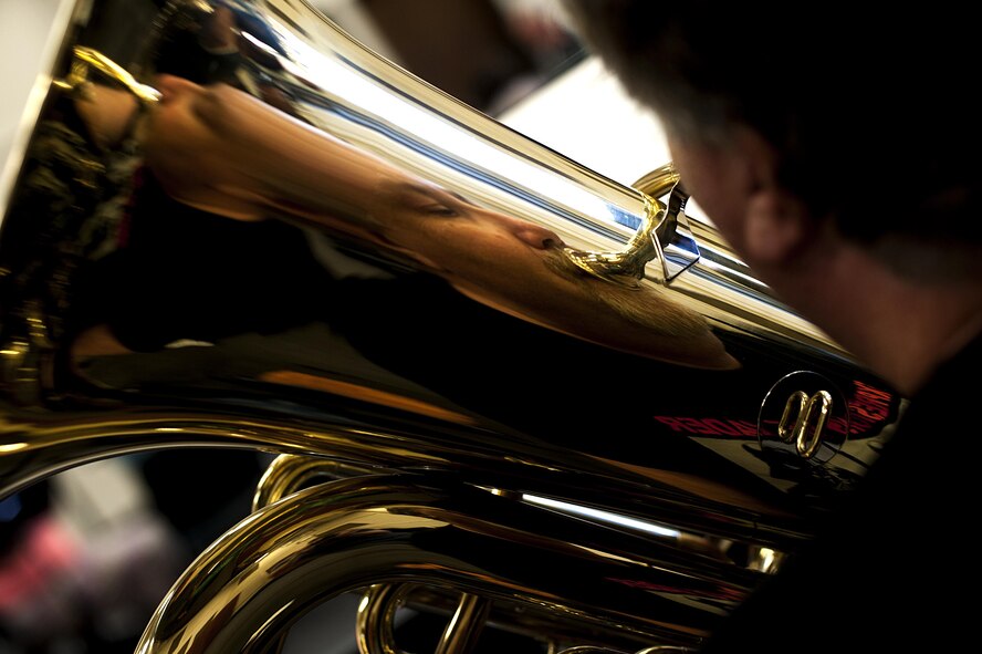 Eric T. Hansen, 17th Training Group security systems operations, practices his tuba during a band practice in the band hall at Angelo State University, San Angelo, Texas, July 28, 2015. The San Angelo Community plays two shows a year, one in August and one in late December. (U.S. Air Force photo by Senior Airman Scott Jackson)