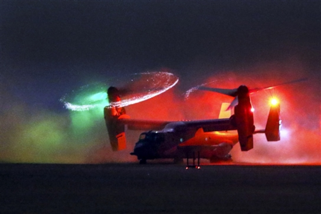 An MV-22 Osprey lands during a training exercise to recover personnel in Southwest Asia, July 28, 2015. The 185th Theater Aviation Brigade conducts interoperability training missions to enhance capabilities between U.S. Army aviation and other U.S. military forces.