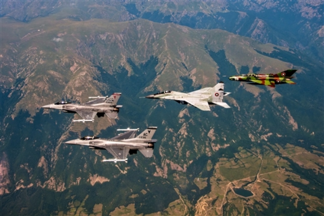 Two U.S. Air Force F-16C Fighting Falcons lead a mixed formation including a Bulgarian air force MiG-29 Fulcrum and MiG-21 Fishbed during Thracian Star 2015 over Bulgaria, July 20, 2015.