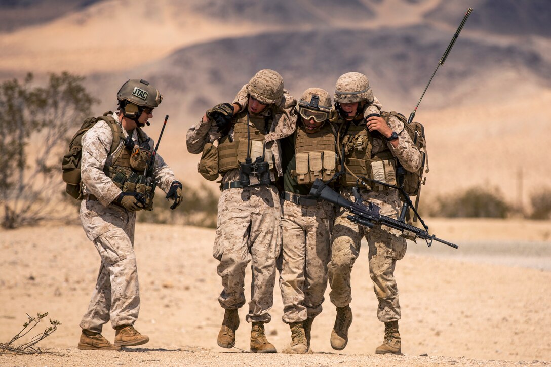 Marines conduct a simulated casualty evacuation during an Integrated Training Exercise on Marine Corps Air Ground Combat Center Twentynine Palms, Calif., July 19, 2015.