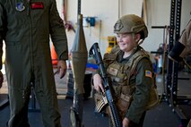 Eddie Paul Bearb, a 9-year-old battling Acute Lymphoblastic Leukemia, tours the Explosive Ordnance Disposal squadron as part of his experience as Pilot For A Day at Joint Base Pearl Harbor-Hickam, Hawaii, July 30, 2015. The program was created to provide children with serious or chronic conditions the opportunity to experience life as an honorary pilot. (U.S. Air Force photo by 2nd Lt. Kaitlin Daddona/Released)