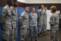 Chief Master Sgt. Gay Veale, command chief master sergeant of the Eleventh Air Force, Talks with Airmen from the 15th Aircraft Maintenance Unit on Joint Base Pearl Harbor-Hickam, Hawaii, July 27, 2015. During the visit Veale meet with Junior enlisted, noncommissioned officers and senior noncommissioned officers as well as wing, group and squadron leadership to discuss the unique joint base structure here. (U.S. Air Force Photo by Tech Sgt. Aaron Oelrich/Released)