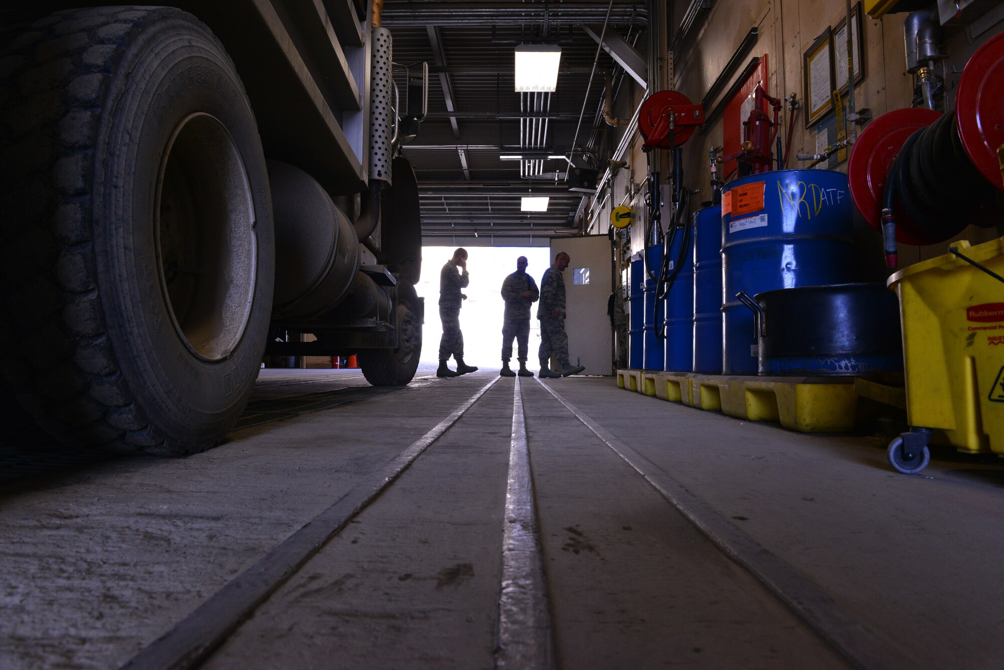 Visiting personnel from Joint Base Elmendorf-Richardson, Alaska place hearing protection in before being escorted into the inner-workings of the Indian Mountain long-range radar site's infrastructure as part of a tour July 21. The radar site monitors Alaskan airspace for unauthorized aircraft. (U.S. Air Force photo/Airman 1st class Kyle Johnson)