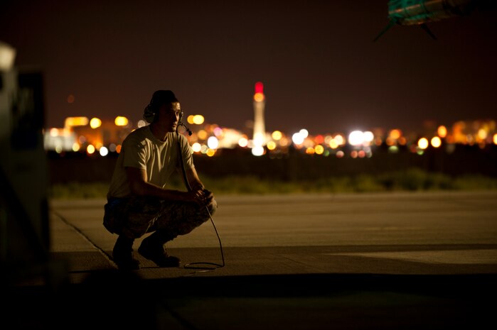 Staff Sgt. Kenneth Fearon, a crew chief assigned to the 20th Aircraft Maintenance Squadron, Shaw Air Force Base, S.C., conducts pre-flight inspections on an F-16 Fighting Falcon prior to a Red Flag 15-3 night training sortie at Nellis Air Force Base, Nev., July 28, 2015. Aircraft maintenance continues throughout the night to ensure aircrews continue to receive an effective, but most of all safe, training experience. (U.S. Air Force photo by Senior Airman Joshua Kleinholz)

