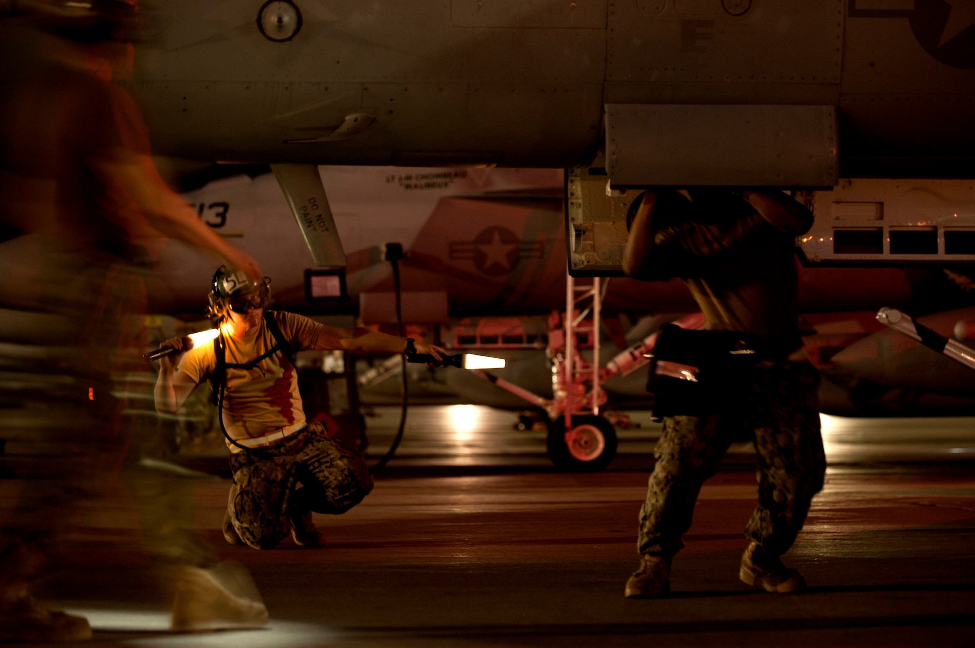 U.S. Navy sailors assigned to Electronic Attack Squadron 138, Whidbey Island, Wash., conduct pre-flight inspections on an EA-18G Growler prior to a Red Flag 15-3 night training sortie at Nellis Air Force Base, Nev., July 28, 2015. Red Flag gives aircrews and air support operations service members from various airframes, military services and allied countries an opportunity to integrate and practice combat operations. (U.S. Air Force photo by Senior Airman Joshua Kleinholz)