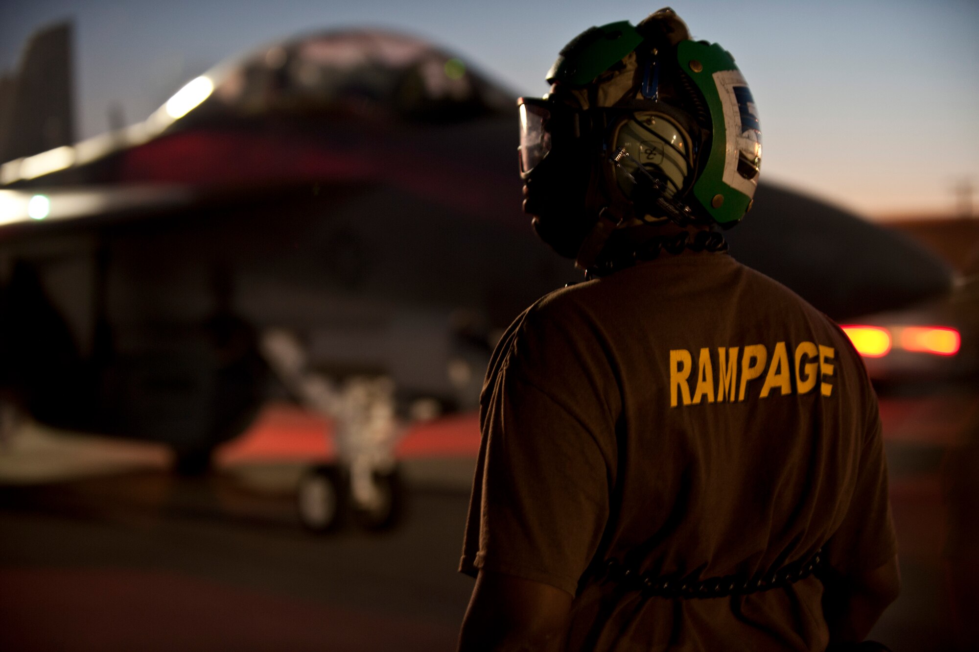 A U.S. Navy sailor assigned to Electronic Attack Squadron 138, Whidbey Island, Wash., conducts pre-flight inspections on an EA-18G Growler prior to a Red Flag 15-3 night training sortie at Nellis Air Force Base, Nev., July 28, 2015. The exercise is conducted on the 2.9 million acre Nevada Test and Training Range north of Las Vegas. (U.S. Air Force photo by Senior Airman Joshua Kleinholz)