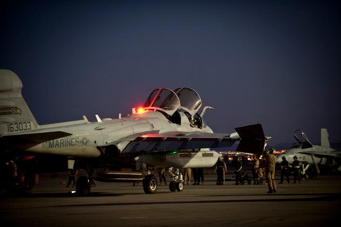 An EA-6B Prowler assigned to Marine Tactical Electronic Warfare Squadron 4, Marine Corps Air Station Cherry Point, N.C., undergoes pre-flight inspections prior to a Red Flag 15-3 night training sortie at Nellis Air Force Base, Nev., July 28, 2015. Flying units from around the Department of Defense deploy to Nellis AFB to participate in Red Flag exercises that are typically held three to four times a year and organized by the 414th Combat Training Squadron. (U.S. Air Force photo by Senior Airman Joshua Kleinholz)