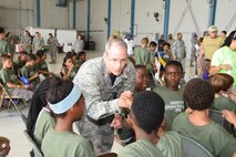 Brig. Gen. Robert La Brutta,  502d Air Base Wing commander, made the closing remarks  at a mock deployment for almost 200 children at Joint Base San Antonio-Lackland, Texas on July 31, 2015. The general then left the stage to give high fives and "blow it up" to thank the children for supporting their parents when they deploy. (U.S. Air Force photo/Tech. Sgt. Carlos J. Trevino)