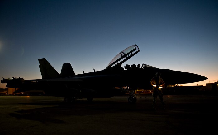 U.S. Navy aircrew members assigned to Electronic Attack Squadron 138, Naval Air Station Whidbey Island, Wash., await clearance to taxi during Red Flag 15-3 at Nellis Air Force Base, Nev., July 28, 2015. Red Flag is one of a series of advanced training programs administered at Nellis AFB and on the Nevada Test and Training Range. (U.S. Air Force photo by Airman 1st Class Rachel Loftis)   