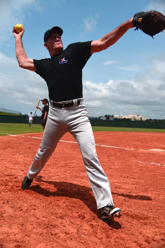 Col. Dennis Seymour, 927th Mission Support Group commander paints the corners during the 2015 Pro Fast Pitch X-Treme Championship Tournament. For almost two-years, Seymour has been pitching for a competitive fast-pitch soft ball league and mentoring young players who are in search of a successful future. Some who are honing softball skills having a good time and others who are driving to represent the United States in the Olympics. (U.S. Air Force Photo by Staff Sgt. Adam Borgman)