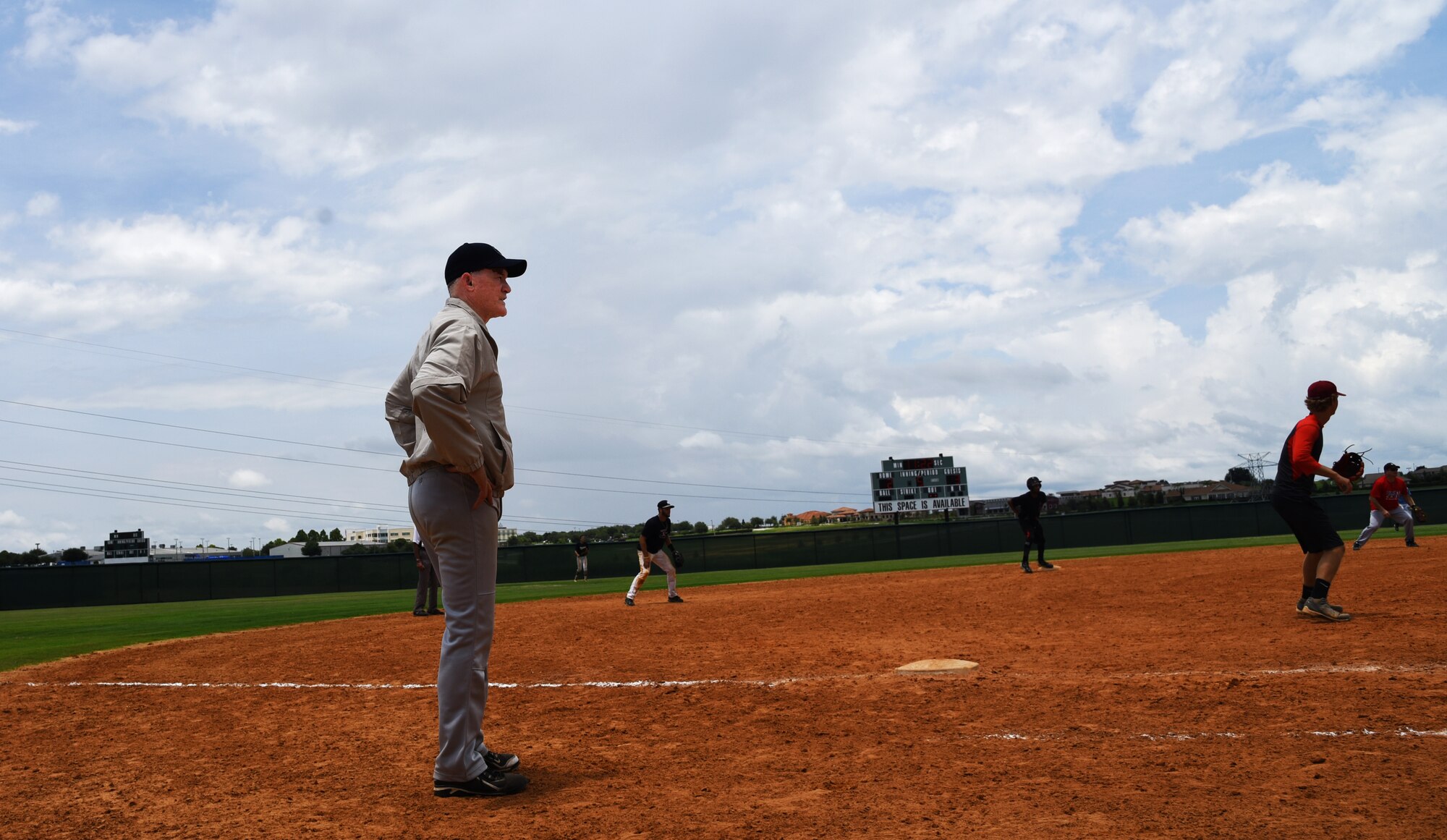 No matter the uniform, Col. Dennis Seymour, 927th Mission Support Group commander, focus is the same; provide valuable mentorship to those around him. Seymour spends his spare time leading his co-ed team to victory during the 2015 Pro Fast Pitch X-Treme Championship Tournament, (PFX) field near Orlando, Florida. (U.S. Air Force Photo by Staff Sgt. Adam Borgman)