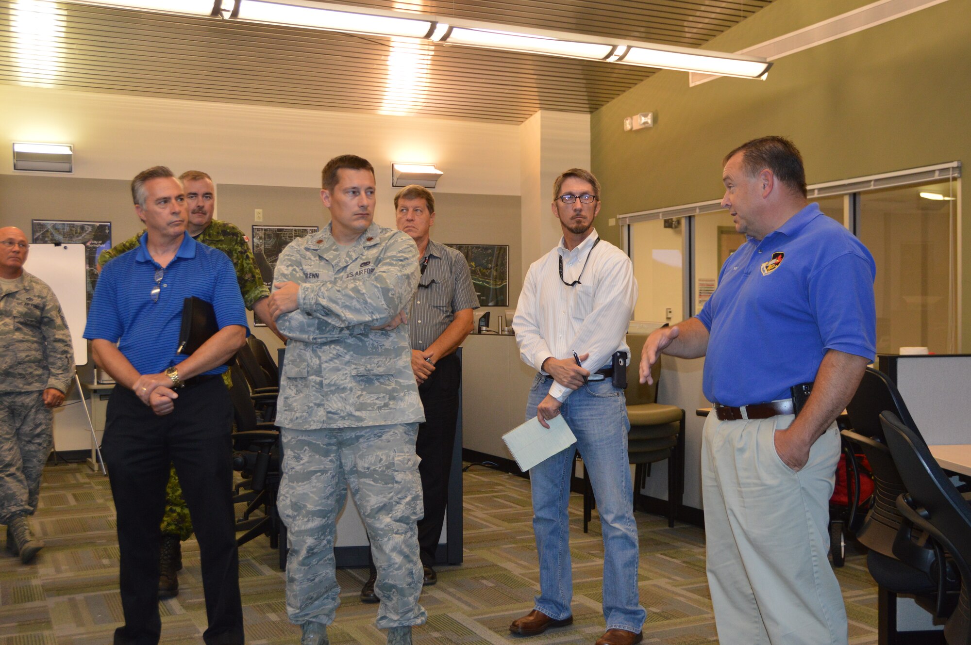 Mark Bowen, (right) Chief, Bay County Emergency Services, explains a point about Bay County emergency response procedures at the Bay County Emergency Operations Center, during a visit by members of Continental U.S. Aerospace Defense Command Region – 1st Air Force  (Air Forces Northern). The group, from Tyndall Air Force Base, Fla., visited the center in Southport, Fla., to learn more about how Bay County officials conduct contingency operations. (Air Force photo released/Mary McHale)