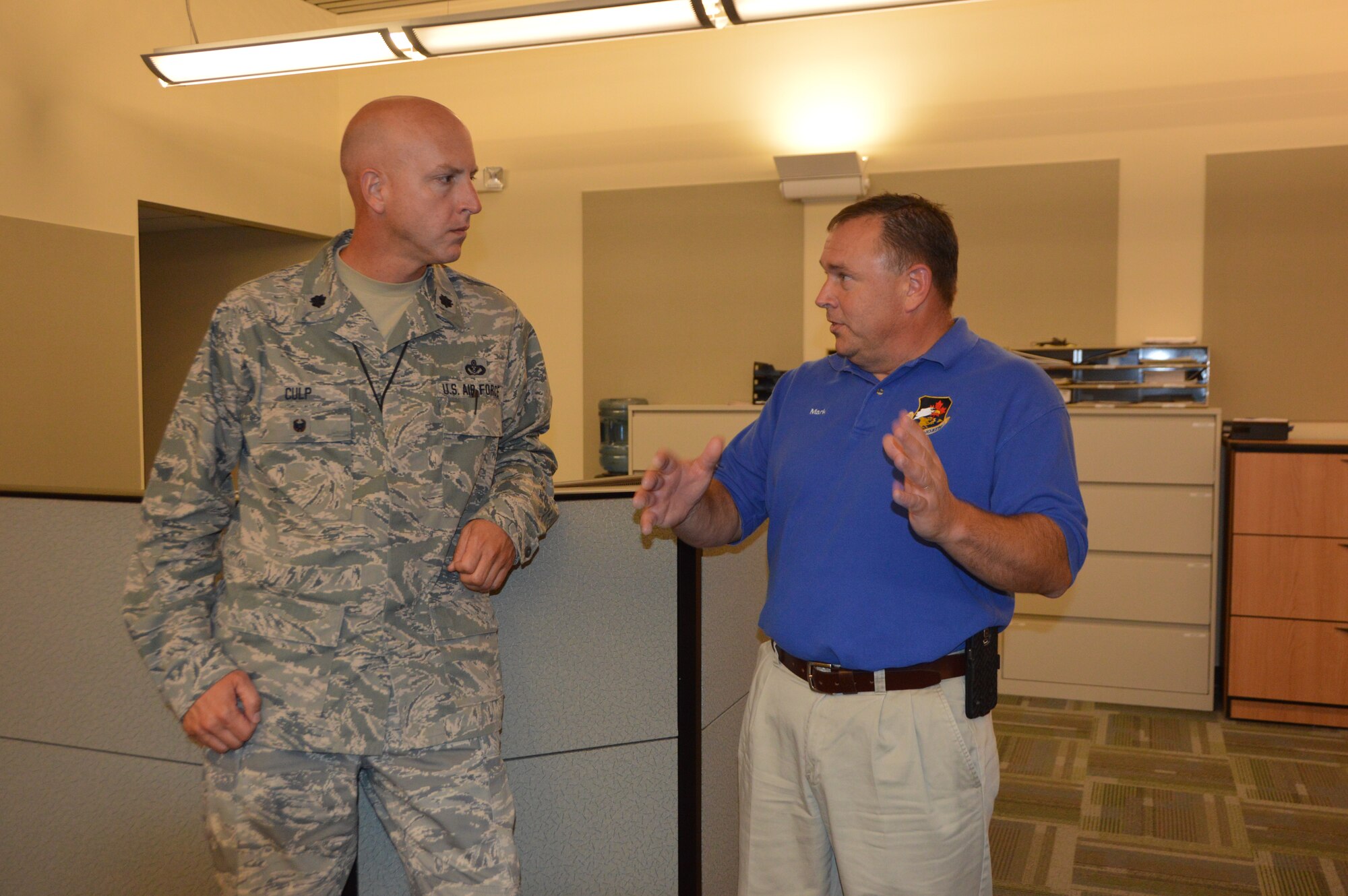 Lt. Col. James Culp, Director, Continental U.S. Aerospace Defense Command Region – 1st Air Force  (Air Forces Northern) Installations and Mission Support directorate, talks  with Mark Bowen,  Chief, Bay County Emergency Services, during a familiarization visit to the Bay County Emergency Operations Center  in Southport, Fla., July 23. During the visit, several members of CONR-1st  AF (AFNORTH), Tyndall Air Force Base, Fla., toured the facilities to learn more about how Bay County officials conduct contingency operations. (Air Force photo released/Mary McHale)