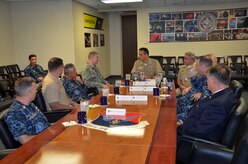Joint Base Charleston leadership conducts an office call with CAPT Maxwell Shuman, the commanding officer of Navy Munitions Command, Continental United States East Division, based in Yorktown, Va. The Navy Munitions Command is designed to align all ashore ordnance support operations in the United States and Asia into one worldwide unit and consolidate 2,100 personnel under three divisions: CONUS East Division, CONUS West Division and East Asia Division. (U.S. Air Force photo/Staff Sgt. AJ Hyatt)