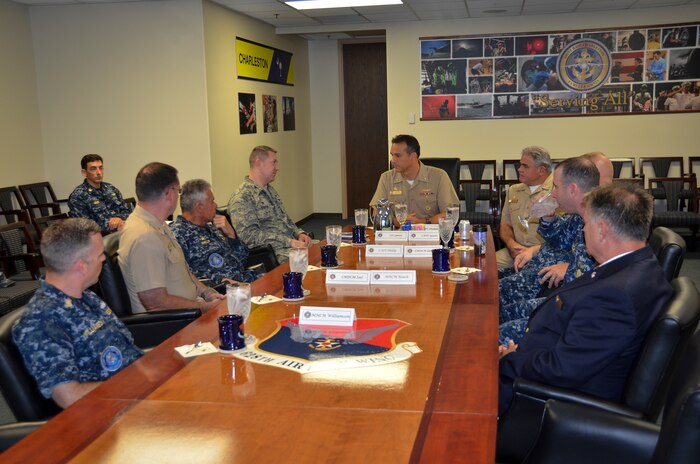 Joint Base Charleston leadership conducts an office call with CAPT Maxwell Shuman, the commanding officer of Navy Munitions Command, Continental United States East Division, based in Yorktown, Va. The Navy Munitions Command is designed to align all ashore ordnance support operations in the United States and Asia into one worldwide unit and consolidate 2,100 personnel under three divisions: CONUS East Division, CONUS West Division and East Asia Division. (U.S. Air Force photo/Staff Sgt. AJ Hyatt)