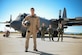 U.S. Marine Corps Capt. Jonathon Leach, 41st Electronic Combat Squadron mission crew commander stands with U.S. Air Force EC-130H Compass Call crew members on the flightline at Davis-Monthan Air Force Base, Ariz., July 31, 2015. He is part of a three-year inter-service exchange program where he flies with Airmen from the 41st ECS. Leach is from Marine Corps Air Station Cherry Point, N.C. (U.S. Air Force photo by Airman 1st Class Cheyenne Morigeau/Released)
