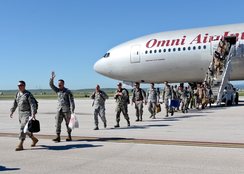 Ellsworth Airmen return from deployment, Ellsworth Air Force Base, S.D., July 30, 2015. Deployers provided operational support to the 379th Air Expeditionary wing, offering long-range strike capabilities, persistent presence, large diverse payloads and organic sensors. (U.S. Air Force photo by Senior Airman Anania Tekurio/Released)