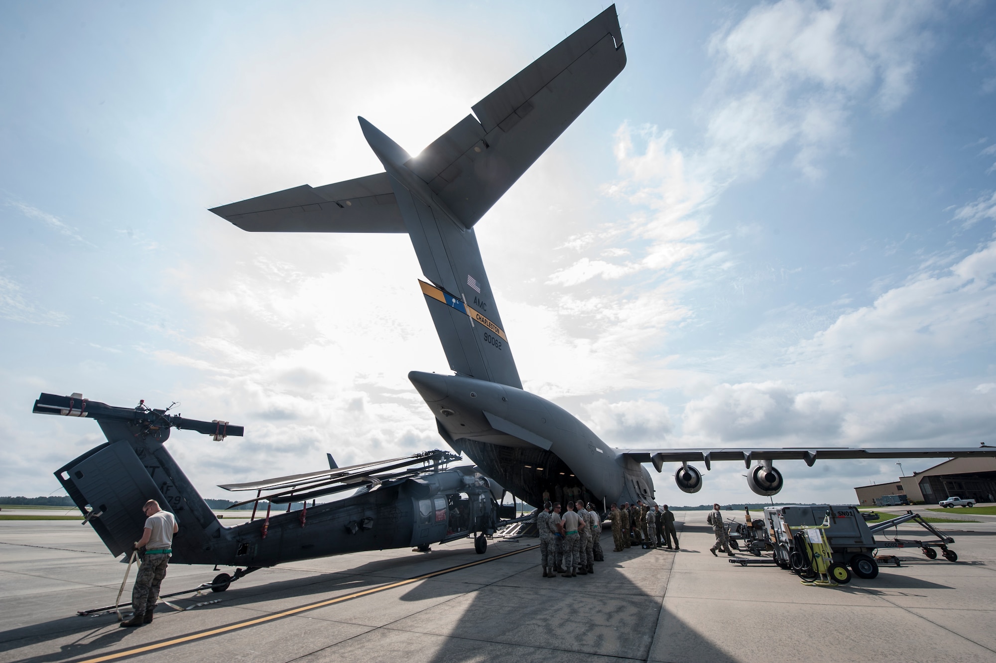 Members of the 41st Helicopter Maintenance Unit load an HH-60G Pave Hawk onto a C-17 Globemaster III during rapid-on, rapid-off training July 30, 2015, at Moody Air Force Base, Ga. The C-17 supports the transportation of multiple HH-60s to deployed locations, a capability only rivaled by the C-5 Galaxy aircraft. (U.S. Air Force photo by Airman 1st Class Dillian Bamman/Released)