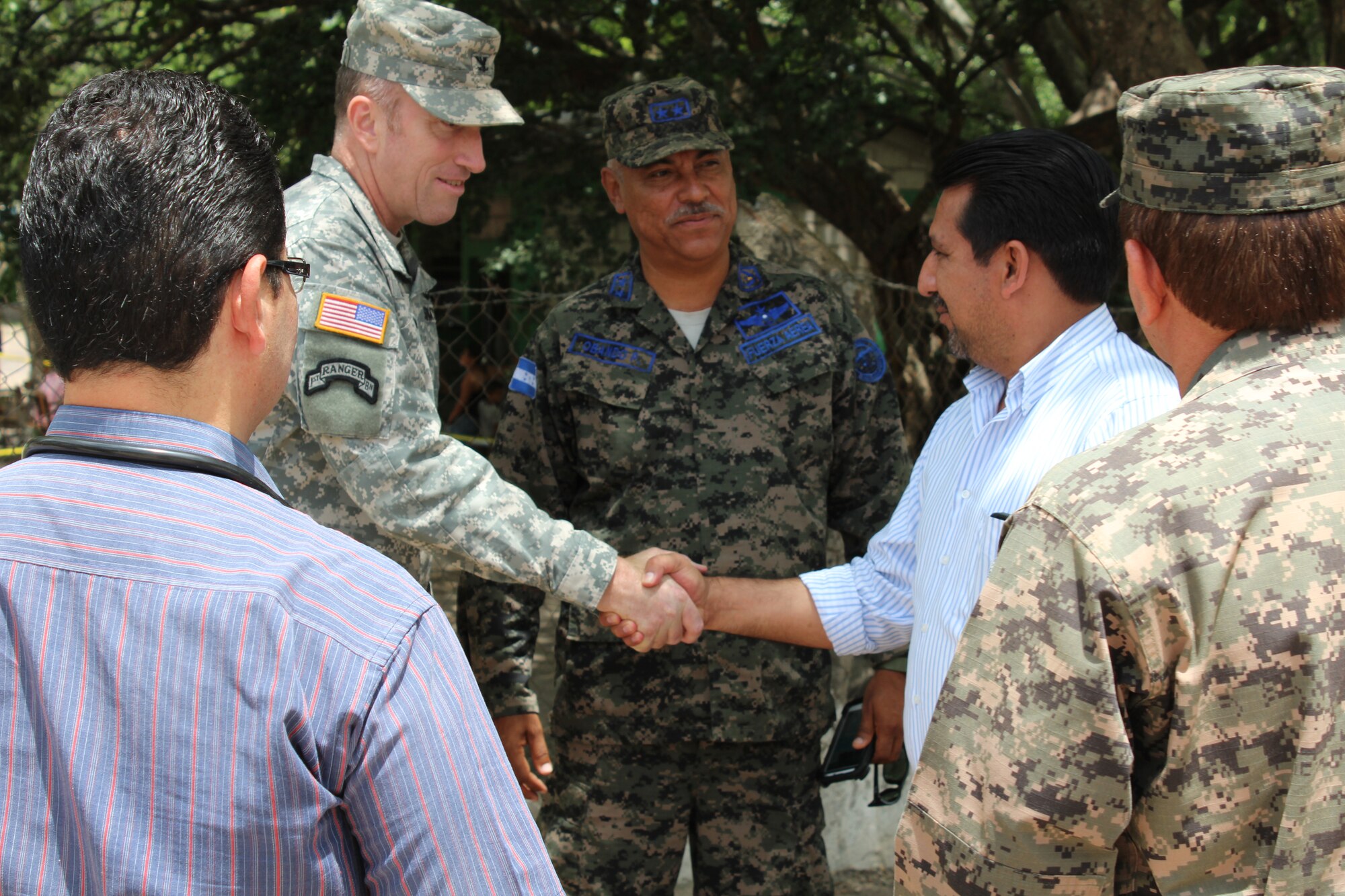 Col. Robert Harman (left), Commander of Joint Task Force-Bravo, and Lt. Col. Fredy Obando (center), Commander of Soto Cano Air Base, greet Manuel Cartagena (right), Deputy Mayor of Comayagua, as he arrives at the Medical Readiness Training Exercise site in the Ramon Ortega School located in Las Liconas, Comayagua, July 29, 2015. Medical Readiness Training Exercises are carried out in coordination with local civil authorities and ministries of health, and allow U.S. service members the opportunity to help local communities while validating their ability to provide services iin expeditionary environments.  (U.S. Army photo by Maria José Pinel) 