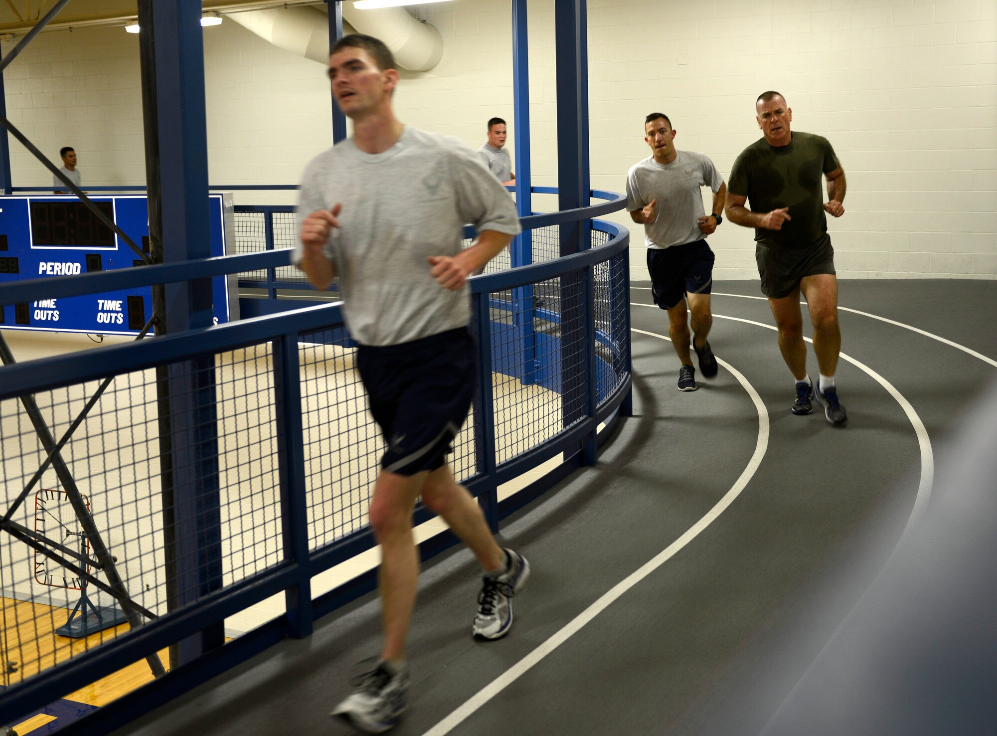 Sgt. Maj. Bryan B. Battaglia, senior enlisted advisor to the chairman of the Joint Chiefs of Staff, works out with members of the 22nd Civil Engineer Squadron, July 31, 2015, at McConnell Air Force Base, Kan. Battaglia visited McConnell to see how the Airmen here stay fit to fight and complete the aerial refueling mission. (U.S. Air Force photo by Senior Airman Trevor Rhynes)