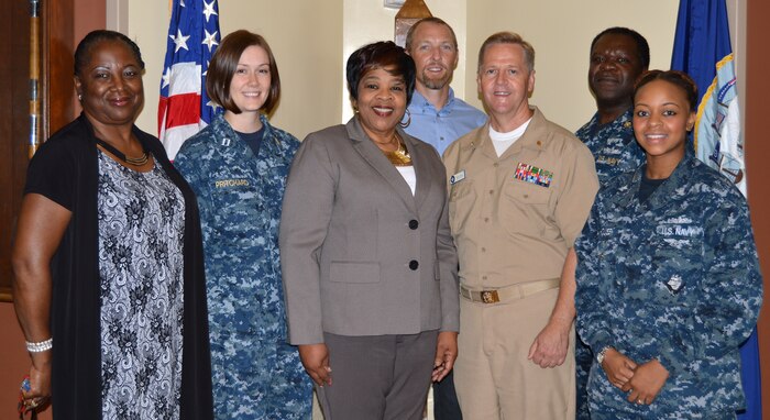 Cutline: Staff members of the Naval Health Clinic Charleston wellness committee pose for a photo. NHCC recently earned the Gold Star, 2014 Blue-H – Navy Surgeon General’s Health Promotion and Wellness Award. Front row, from left to right: Rhonda Mitchellketchens, NHCC Wellness Clinic medical support assistant; Lt. Nikki Pritchard, NHCC Sexual Assault Prevention and Response program coordinator; Linda Washington, NHCC clinical nutritionist and Wellness coordinator; Capt. Danny Denton, director, NHCC Public Health Services, and Petty Officer 2nd Class Janay House, leading petty officer, NHCC Human Resources Department. Back Row: Dr. Scott Berry, NHCC psychologist; and Chief Hospital Corpsman Naji Mohammed, NHCC Alcohol and Drug Abuse Prevention officer. 