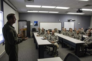 Chief Master Sgt. Bryan DuBois, 317th Airlift Squadron loadmaster superintendent, shares his Air Force Reserve story with a group of Air Force chaplain candidates who visited Joint Base Charleston this week. The 315th Airlift Wing Chaplain Service hosted the 18 second lieutenants in an effort to tell the young officers about the opportunities available to them as Air Force Reserve chaplains. Besides meeting Reserve and active duty Airmen around the base, the group also visited patients at the Charleston VA Medical Center. Over the weekend they were scheduled to participate in the Joint Base Charleston Chapel services with active duty chaplains on the main base and over at the Naval Weapons Station. Weather permitting, they also hope to get a chance to visit the “Holy City's” many historical churches before departing the area. (U.S. Photo by Michael Dukes) 
