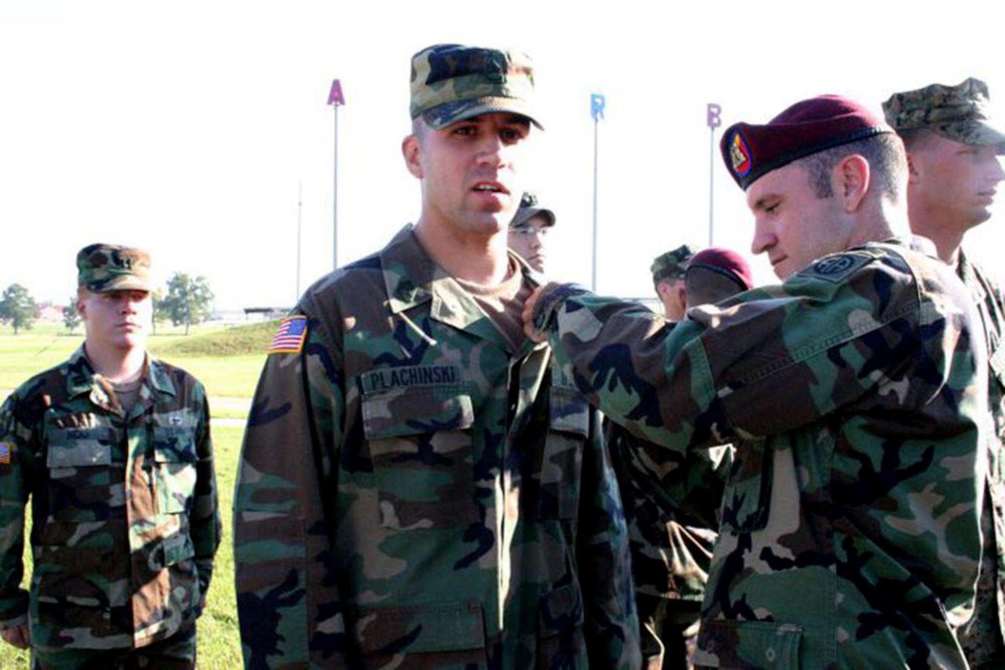 William Plachinski pins parachute wings on his brother, Michael, following an Airborne School  graduation ceremony at Fort Benning, GA, in September 2005. The brothers are now both first sergeants with United States Army Alaska. (courtesy photo)