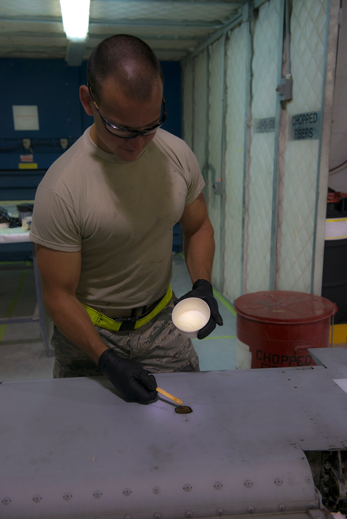 U.S. Air Force Airman 1st Class Shawn Beaver, 23d Equipment Maintenance Squadron aircraft structural apprentice, fills a gauge on an A-10C Thunderbolt II elevator surface July 28, 2015, at Moody Air Force Base, Ga. Aircraft structural maintainers repair structural components, fabricate parts and paint Moody’s aircraft. (U.S. Air Force photo by Airman 1st Class Kathleen D. Bryant/Released)