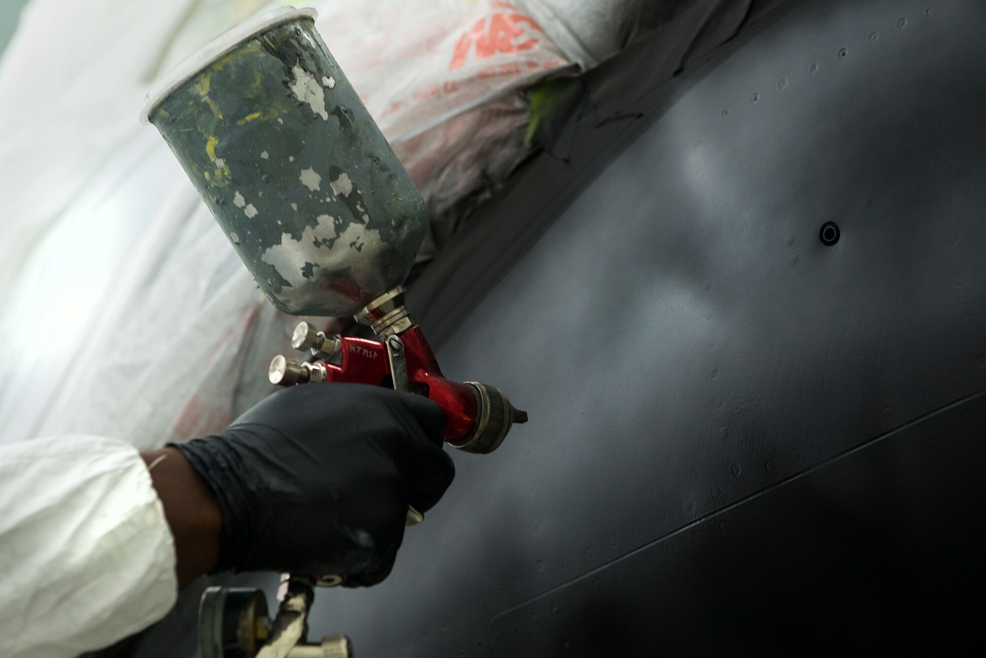 U.S. Air Force Airman 1st Class Johnny Walker, 23d Equipment Maintenance Squadron aircraft structural apprentice, paints legendary Fighting Tiger ‘teeth’ on an A-10C Thunderbolt II July 28, 2015, at Moody Air Force Base, Ga. Aircraft structural maintenance works on three of Moody’s aircraft including the A-10C Thunderbolt II, the HC-130P/J Combat King and the HH-60G Pave Hawk. (U.S. Air Force photo by Airman 1st Class Kathleen D. Bryant/Released)