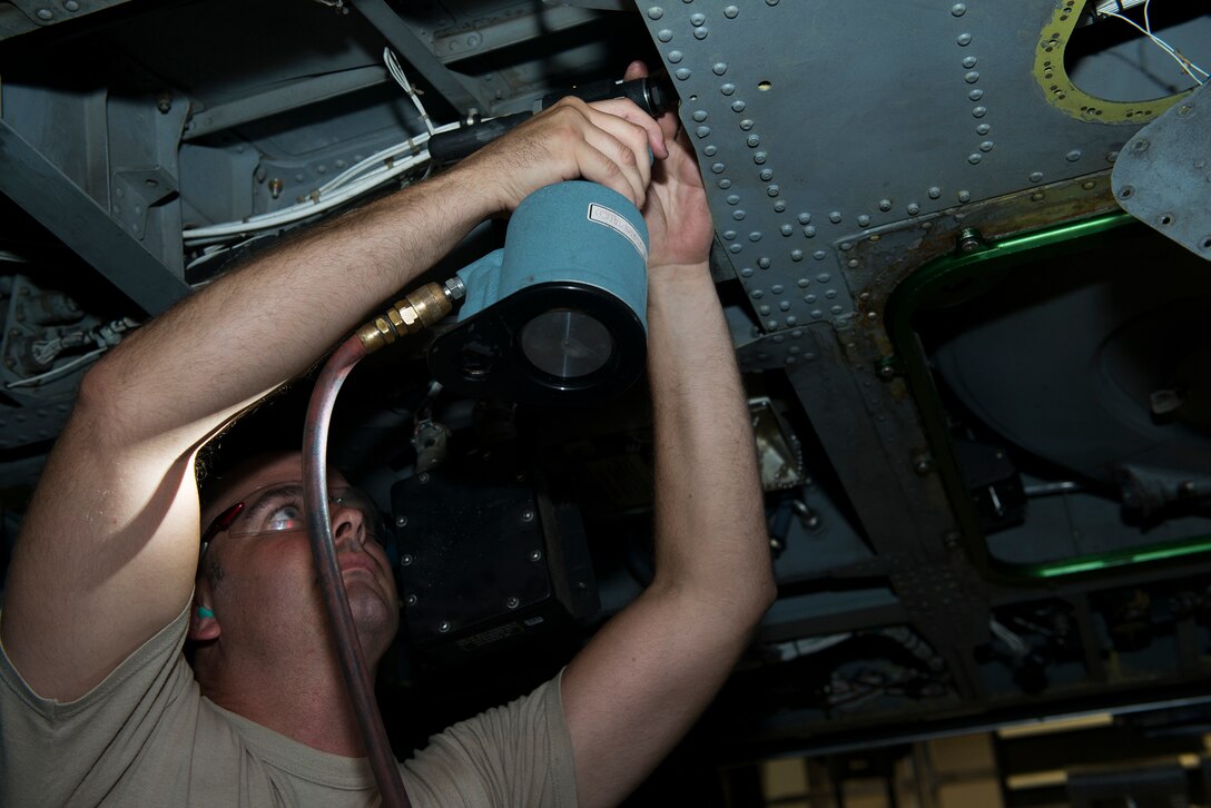 U.S. Air Force Staff Sgt. John Routh, 23d Equipment Maintenance Squadron aircraft structural craftsman, repairs a structural beam in the cabin of an HH-60G Pave Hawk July 28, 2015, at Moody Air Force Base, Ga. Aircraft structural maintenance focuses on fixing structural components, fabricating parts and painting the aircraft. (U.S. Air Force photo by Airman 1st Class Kathleen D. Bryant/Released)