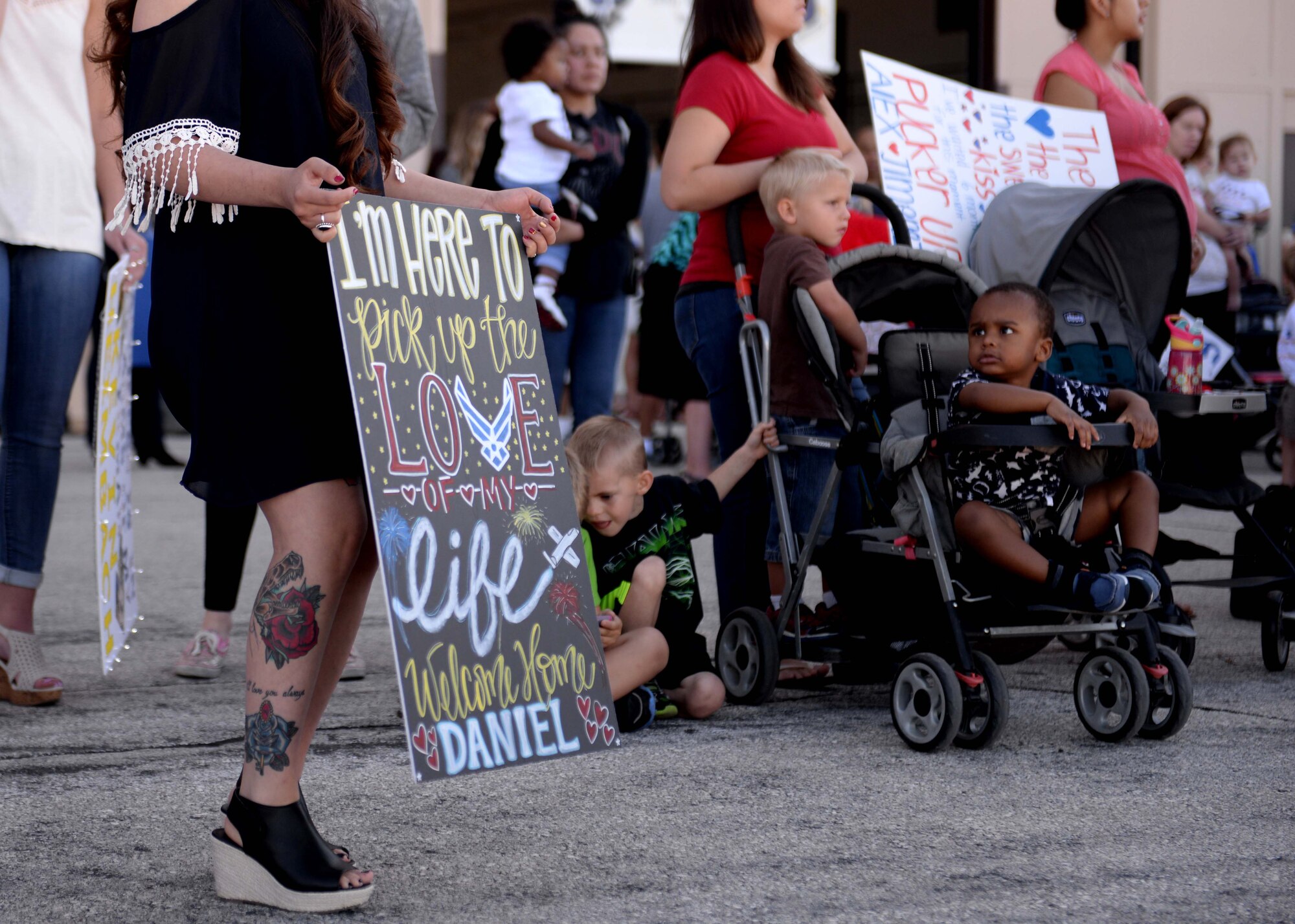 Friends and families gathered to welcome Airmen upon their return from deployment at Ellsworth Air Force Base, S.D., July 30, 2015. Approximately 350 Airmen returned to Ellsworth following a six-month deployment to Southwest Asia. (U.S. Air Force photo by Senior Airman Rebecca Imwalle/ Released)