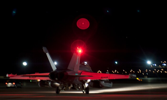 An EA-18G Growler taxis toward the end-of-runway in preparation to take off during Red Flag 15-3 at Nellis Air Force Base, Nev., July 28, 2015. Red Flag is an air-to-air, air-to-ground, and cyber combat training exercise conducted over the 2.9 million acre Nevada Test and Training Range north of Las Vegas. (U.S. Air Force photo by Airman 1st Class Mikaley Towle)