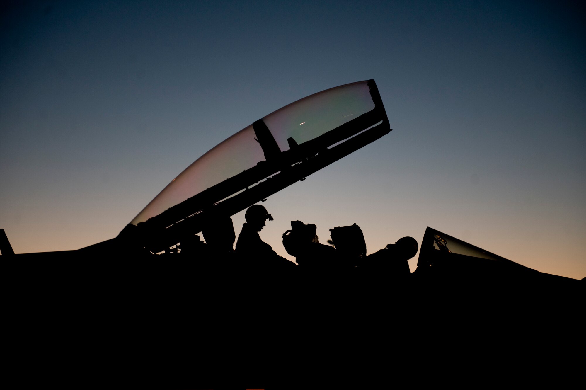 U.S. Navy aircrew members assigned to Electronic Attack Squadron
138, Naval Air Station Whidbey Island, Wash., await clearance to taxi
their aircraft during Red Flag 15-3 at Nellis Air Force Base, Nev., July 28.
Red Flag is one of a series of advanced training programs administered
at Nellis AFB and on the Nevada Test and Training Range. (U.S. Air Force photo by Airman 1st Class Rachel Loftis)   