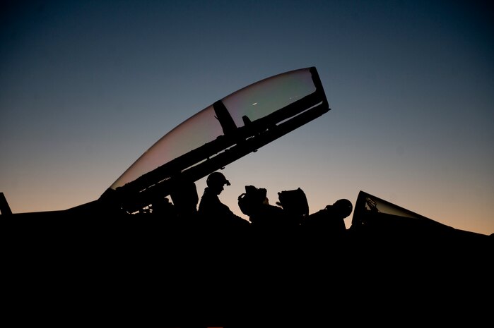 U.S. Navy aircrew members assigned to Electronic Attack Squadron
138, Naval Air Station Whidbey Island, Wash., await clearance to taxi
their aircraft during Red Flag 15-3 at Nellis Air Force Base, Nev., July 28.
Red Flag is one of a series of advanced training programs administered
at Nellis AFB and on the Nevada Test and Training Range. (U.S. Air Force photo by Airman 1st Class Rachel Loftis)   