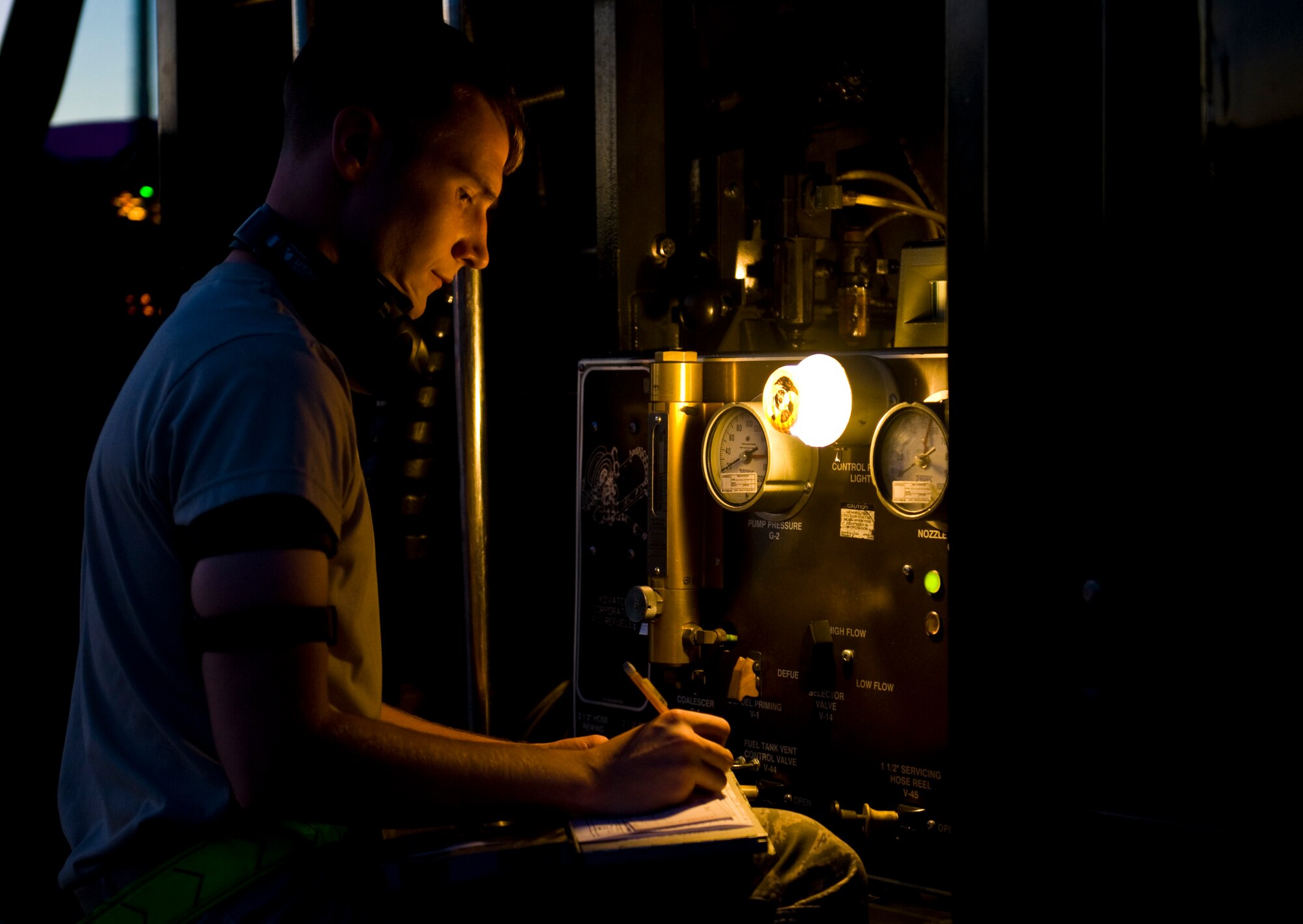 Senior Airman Kevin Raver, a fuels apprentice assigned to the 97th Logistics
Readiness Squadron, Altus Air Force Base, Okla., fills out paperwork after
refueling an EA-18G Growler during Red Flag 15-3 at Nellis Air Force
Base, Nev., July 28. During Red Flag, the 99th LRS fuels management
flight receives augmented troops from the reserve, Air National Guard
and active duty component from different bases around the world.(U.S. Air Force photo by Airman 1st Class Rachel Loftis)   