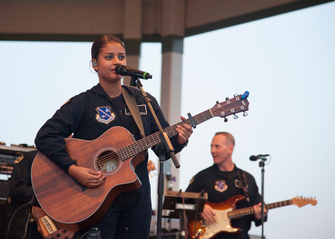 Max Impact, the premier rock band of the U.S. Air Force, performs a free show for the public at the Rehoboth Beach Bandstand July 24, 2015, in Rehoboth, Del. Stationed at Joint Base Anacostia-Bolling in Washington, D.C., Max Impact is one of six musical ensembles that comprise the U.S. Air Force Band. (U.S. Air Force photo/Senior Airman Jared Duhon) 