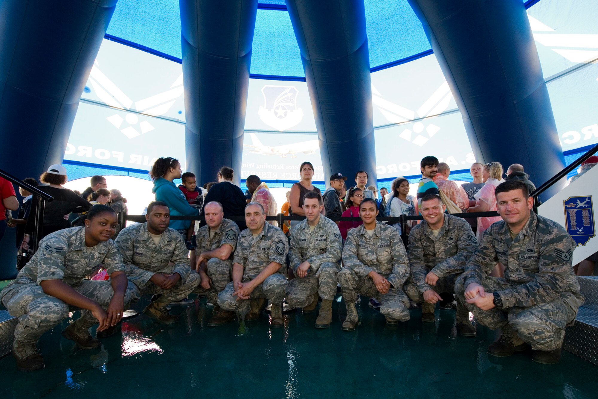 From left to right, Senior Airman Kayla Rivera, 434th Aerospace Medicine Squadron health services specialist; Senior Airman Brent Cannon, 434th AMDS medical services specialist; Master Sgt. Corey Fields, 434th Maintenance Squadron structural maintenance supervisor; Senior Master Sgt. Douglas Stogsdill, 434th MXS fabrications flight chief; Senior Airman Sean Kaufmann, 434th Civil Engineer Squadron, Senior Airman Laura Jauregui, 434th CES structural specialist; Staff Sgt. Joe Meyer, 434th Aircraft Maintenance Squadron crew chief and Staff Sgt. Thomas Vasbinder, 434th AMXS crew chief, pose for a photo at the Dayton Vectron Airshow in Dayton, Ohio, June 20, 2015. During the event, the eight Airmen setup up and operated Grissom?s interactive flight deck and boom pod displays while sharing their military knowledge with visitors. (U.S. Air Force photo/Tech. Sgt. Benjamin Mota)