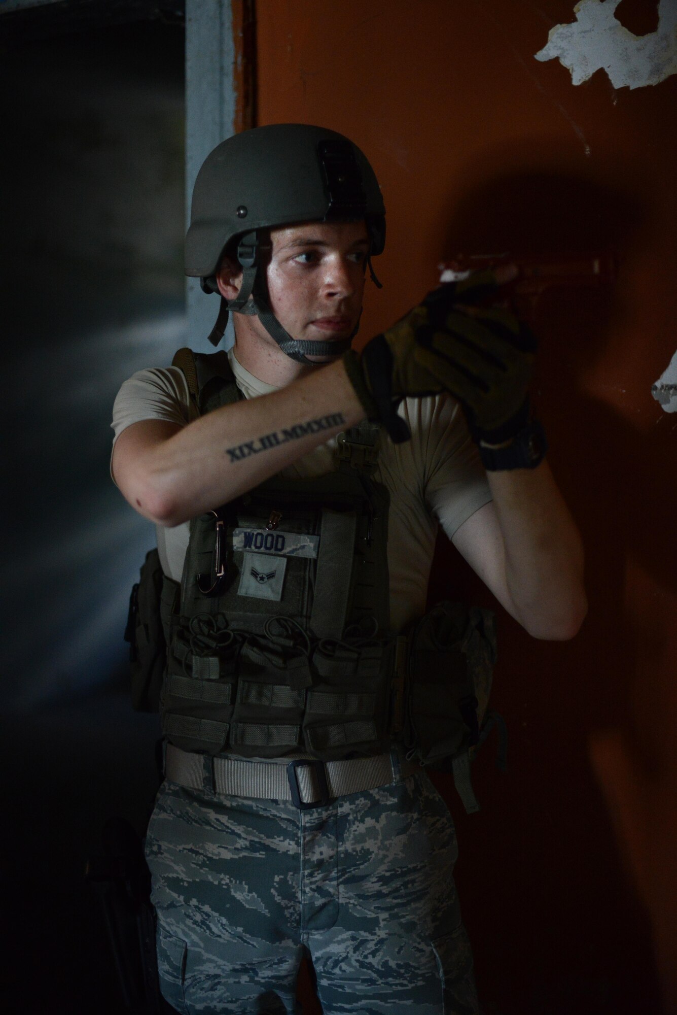 U.S. Air Force Airman 1st Class Alec Wood, 31st Security Forces Squadron defender, clears a room during training July 30, 2015, at Aviano Air Base, Italy.  Approximately 20 defenders trained on breaching, clearing and other defensive and offensive tactics to prepare them for real-life situations. (U.S. Air Force photo by Staff Sgt. Evelyn Chavez/Released)
