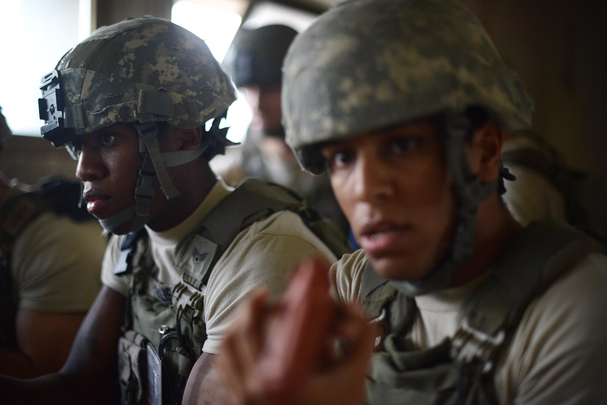(From left) U.S. Air Force Senior Airmen Jeffrey Ellis and Eduardo Virgil, 31st Security Forces Squadron defenders clear an abandoned room July 30, 2015, at Aviano Air Base, Italy.  Approximately 20 defenders trained on security breaches, clearing buildings and other defensive and offensive tactics to prepare for real-life situations. (U.S. Air Force photo by Staff Sgt. Evelyn Chavez/Released)