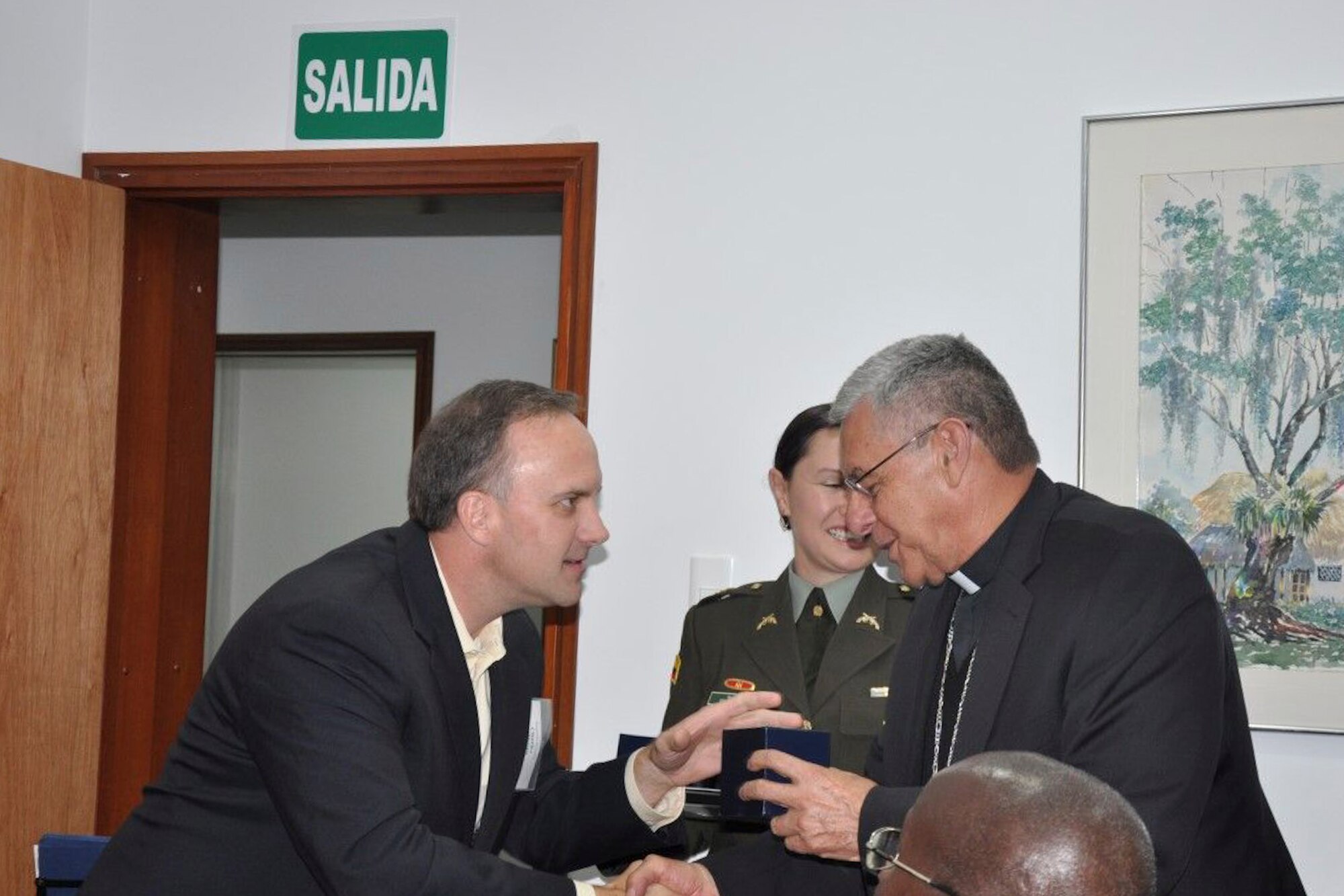 U.S. Air Force Master Sgt. Charles Williams Chaplain Assistant, receives a gift from Monsignor Fabio Suescun Mutis, Archbishop for the Colombian Military, during a 
(Courtesy Photo/Released)