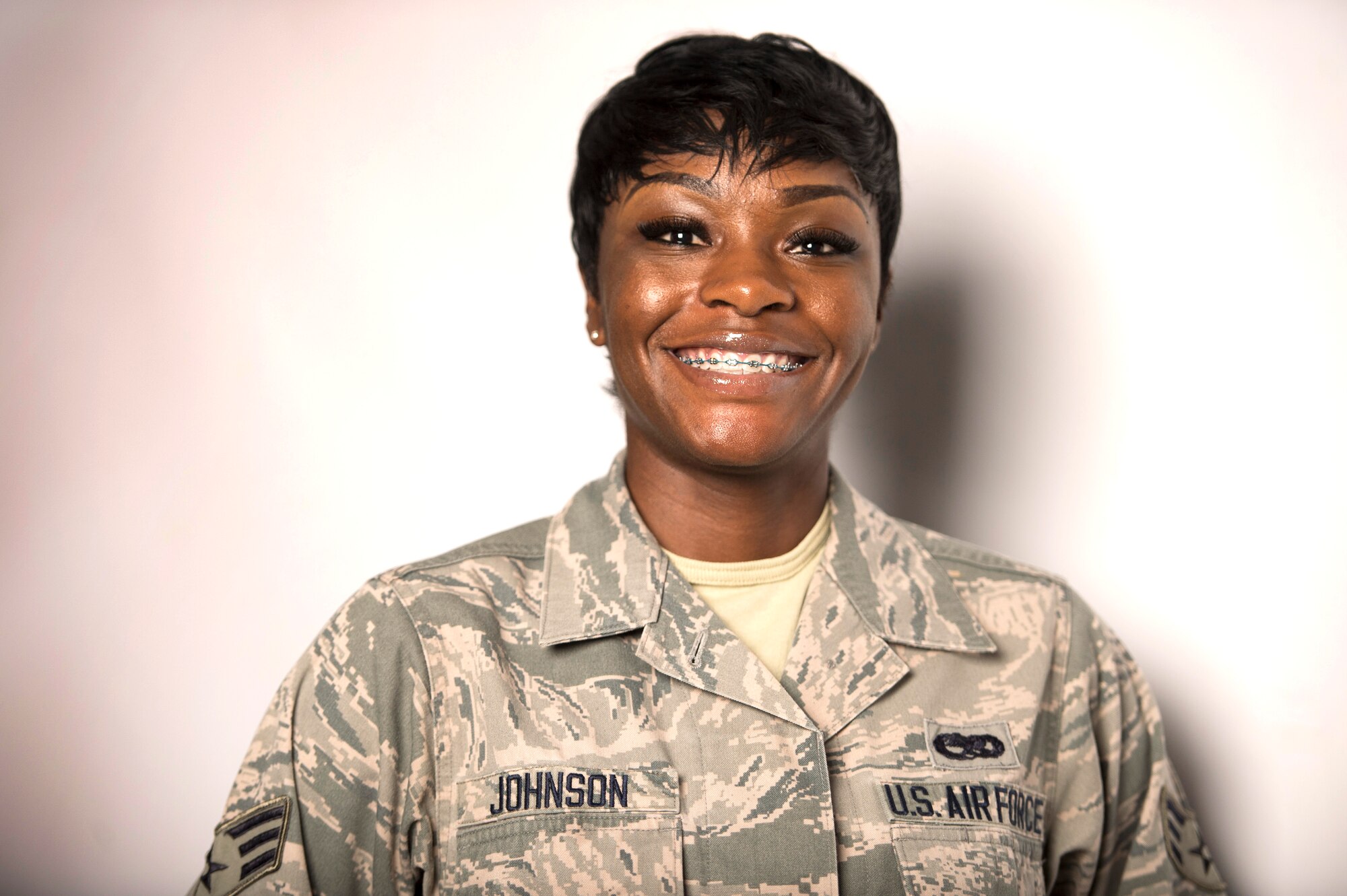U.S. Air Force Senior Airman Kyara Johnson, 94th Aircraft Maintenance Unit weapons loader, is a member of the F-22 Raptor Demonstration Team, stationed at Langley Air Force Base, Va. Before joining the team, Johnson was responsible for loading bombs and missiles onto the Raptor, as well as, ensuring the weapon system remained up-to-date. (U.S. Air Force photo by Senior Airman Kayla Newman/Released)