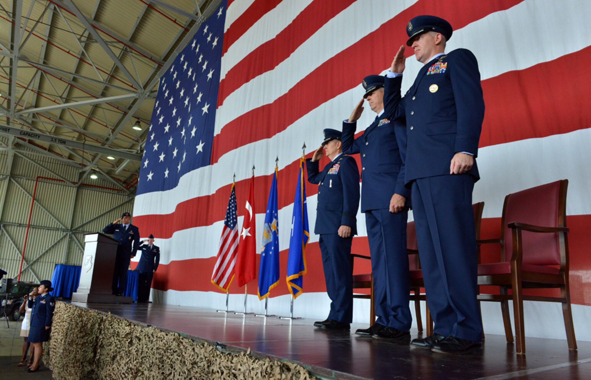 Col. John Walker accepts command of the 39th Air Base Wing during the wing’s change of command ceremony July 31, 2015, at Incirlik Air Base, Turkey. The ceremony is a tradition in which authority and responsibility for a unit is transferred from one officer to another. (U.S. Air Force photo by Senior Airman Michael Battles/Released)   