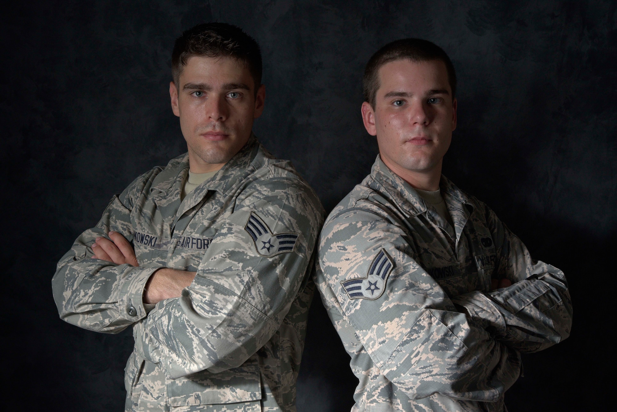 U.S. Air Force Senior Airmen Andrzej Pankowski, 35th Logistics Readiness Squadron traffic management journeyman, and Jarek Pankowski, 35 LRS cargo specialist, pose for a picture at Misawa Air Base, Japan, July 31, 2015. Separated for nearly a decade because of school, work and other circumstances, the Pankowski brothers were reunited at Misawa, after joining the Air Force. (U.S. Air Force photo by Senior Airman Patrick S. Ciccarone/Released)