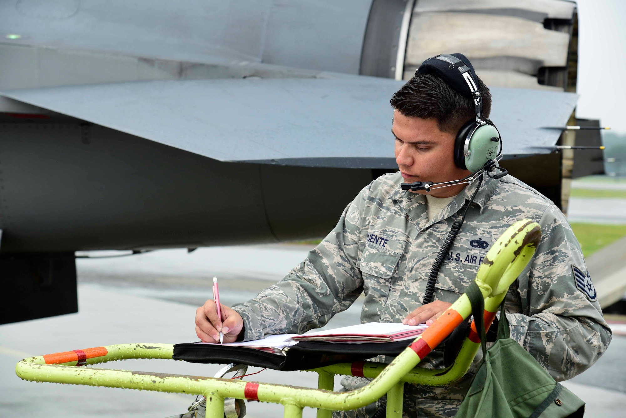 U.S. Air Force Staff Sgt. Cody Puente, 35th Aircraft Maintenance Squadron dedicated crew chief, runs through a pre-flight checklist at Misawa Air Base, Japan, July 28, 2015. Before takeoff occurs, crew chiefs perform scheduled inspections, functional checks and preventive maintenance on aircraft and equipment. (U.S. Air Force photo by Airman 1st Class Jordyn Fetter/Released)