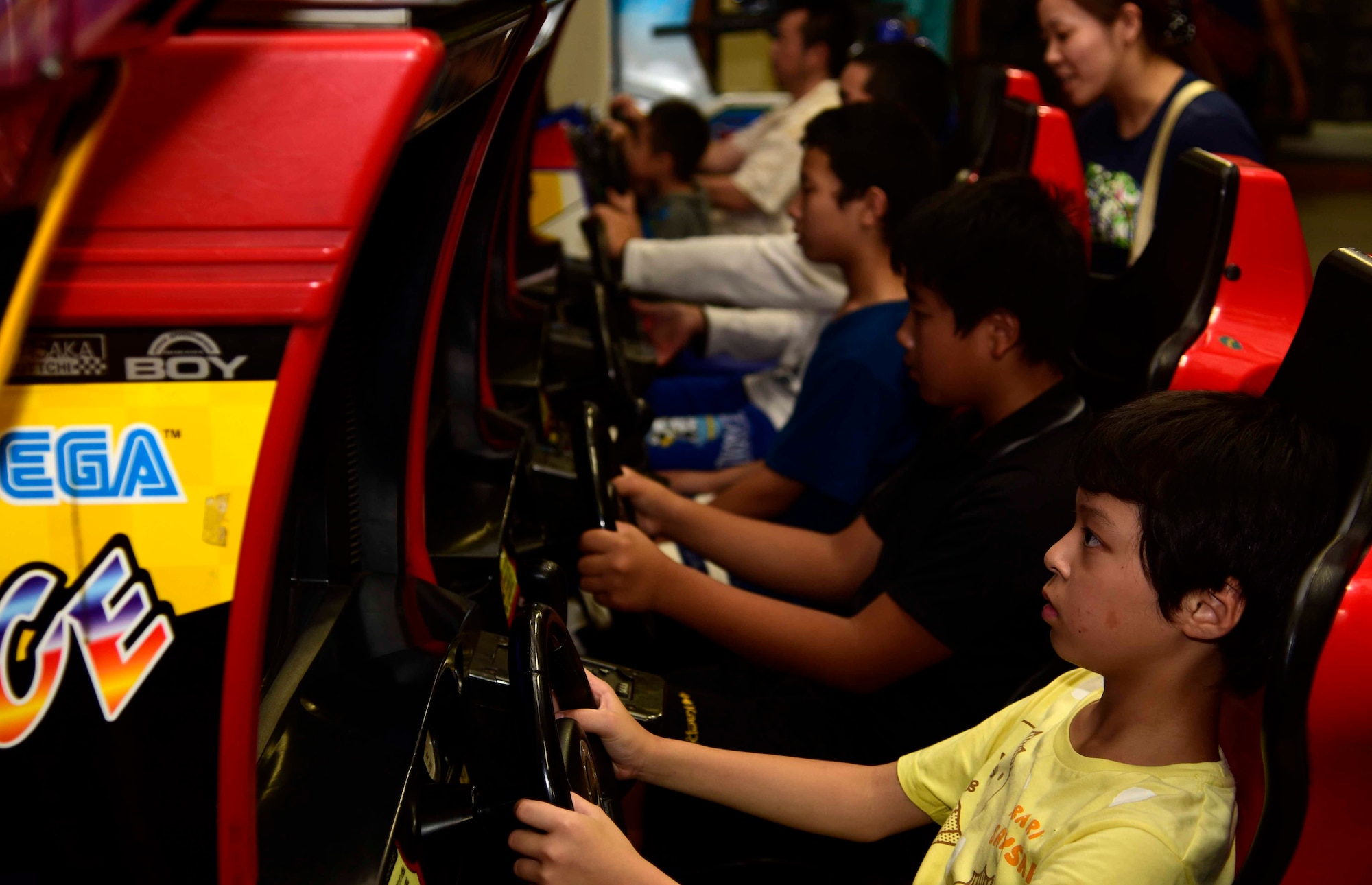 Children from the Shichinohe Children’s Home play arcade games at Misawa Air Base, Japan, July 25, 2015. Forty-five children from the home attended this afternoon event.  (U.S. Air Force photo by Airman 1st Class Jordyn Fetter/Released)